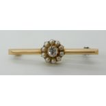 A 15CT GOLD DIAMOND AND PEARL BAR BROOCH the cushion cut diamond dimensions are approx 4.7mm x 4.