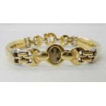 AN 18CT YELLOW AND WHITE GOLD ITALIAN BARAKA BREV BRACELET with logo tag and Italian hallmarks,