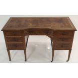 A JAMES SCHOOLBRED & COMPANY MAHOGANY WRITING DESK the top having a leather skiver, top, drawers and