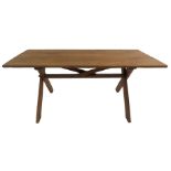 AN ARTS AND CRAFTS OAK TRESTLE TABLE the three plank top above cross frame legs joined by a