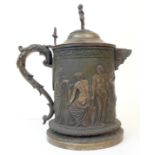 A LARGE ELECTROPLATED JUG decorated with classical figures and floral bands, the top with cherub