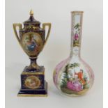 A VIENNA PORCELAIN URN AND COVER with painted figural medallions after Kauffman, on a bleu du roi