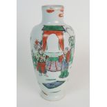 A CHINESE WUCAI BALUSTER VASE painted with noblemen and attendants in a garden, 23cm high