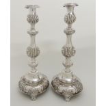 A PAIR OF VICTORIAN SILVER CANDLESTICKS by Slade & Kempton, London 1902, with removable drip pans,