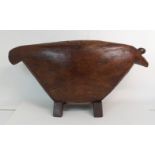 AN AFRICAN HARDWOOD ANIMAL FORM DRUM the broad tapering body on bracket feet, 41cm high and 84cm