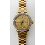 A LADIES 18CT GOLD DIAMOND SET ROLEX OYSTER PERPETUAL DATE JUST with gold coloured dial with diamond