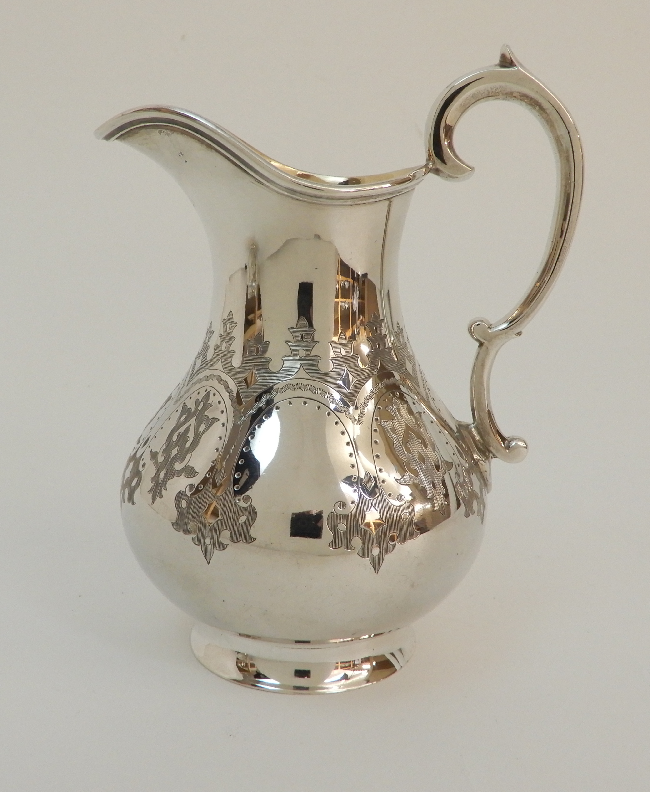 A MATCHED VICTORIAN SILVER THREE PIECE TEA SERVICE by Robert Harper, London 1867, the cream jug - Image 8 of 13