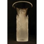 A MODERN LALIQUE LOTUS PATTERN VASE of cylindrical form with flaring neck, the body with frosted