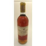 A BOTTLE OF CHATEAU D'YQUEM, LUC-SALUCES, 1957 label stained and dirty Condition Report: Available