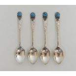 A SET OF FOUR ARTS AND CRAFTS HAMMERED SILVER COFFEE SPOONS by Langstone Silver Works (Bernard