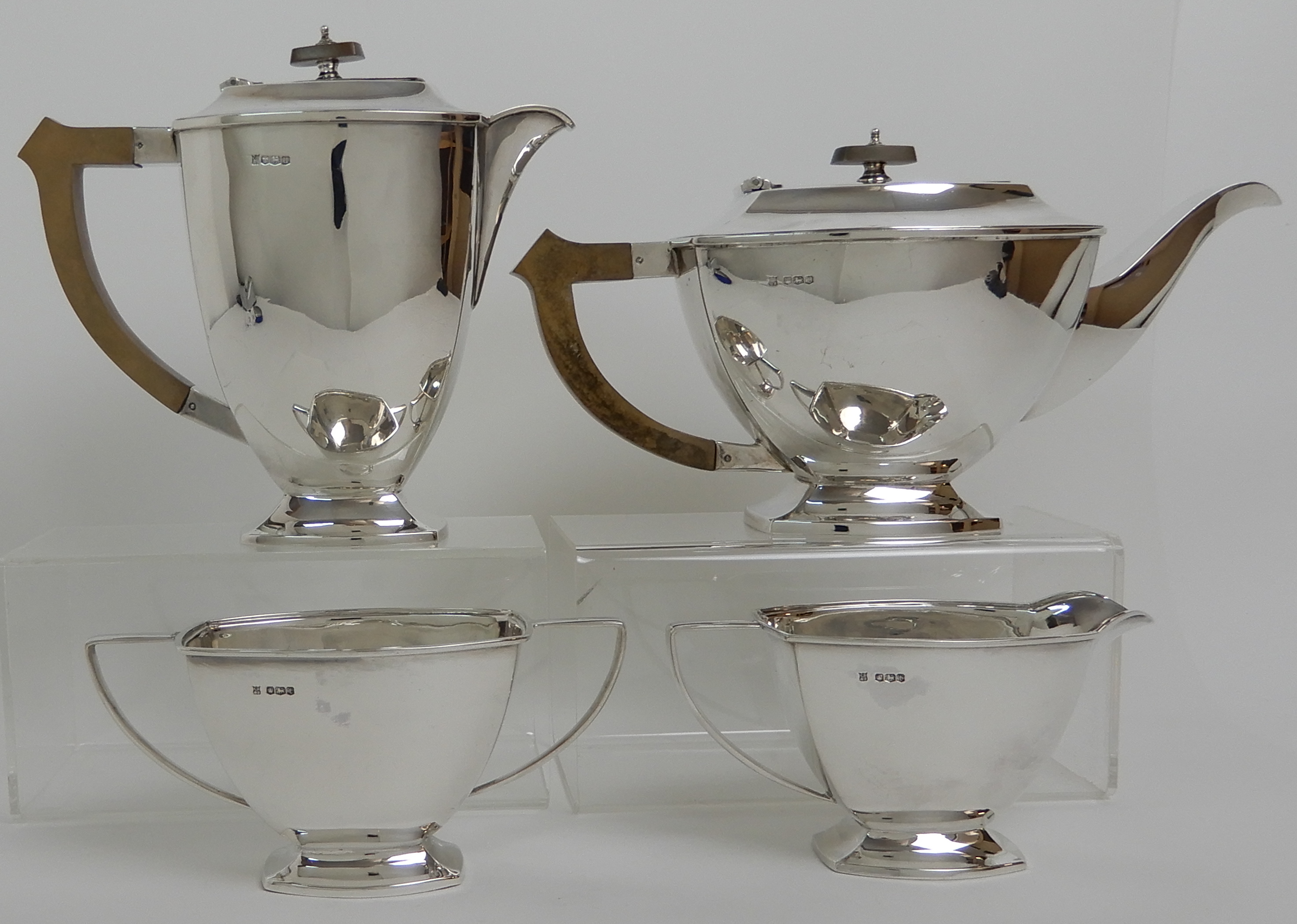 A FOUR PIECE SILVER TEA SERVICE by Cooper Brothers & Sons Limited, Sheffield 1936 and 1937 of