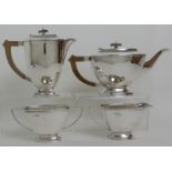 A FOUR PIECE SILVER TEA SERVICE by Cooper Brothers & Sons Limited, Sheffield 1936 and 1937 of