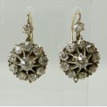 A PAIR OF DIAMOND FLOWER EARRINGS the estimated approx 2.40cts of old cut diamonds are set in yellow