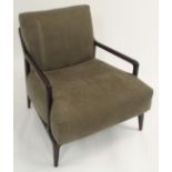 A PHILIPP SELVA INDIGO AMERICAN WALNUT ARMCHAIR with light grey cushions, 80cm high Condition