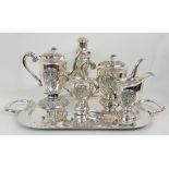 A FOUR PIECE EASTERN SILVER TEA AND COFFEE SERVICE marked Thailand sterling, circa 1920, of tapering