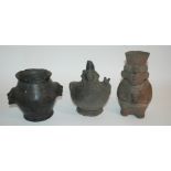 A PRE COLOMBIAN POTTERY FIGURAL VASE seated with arms clasped to his chest,Mochica, 21cm high, a