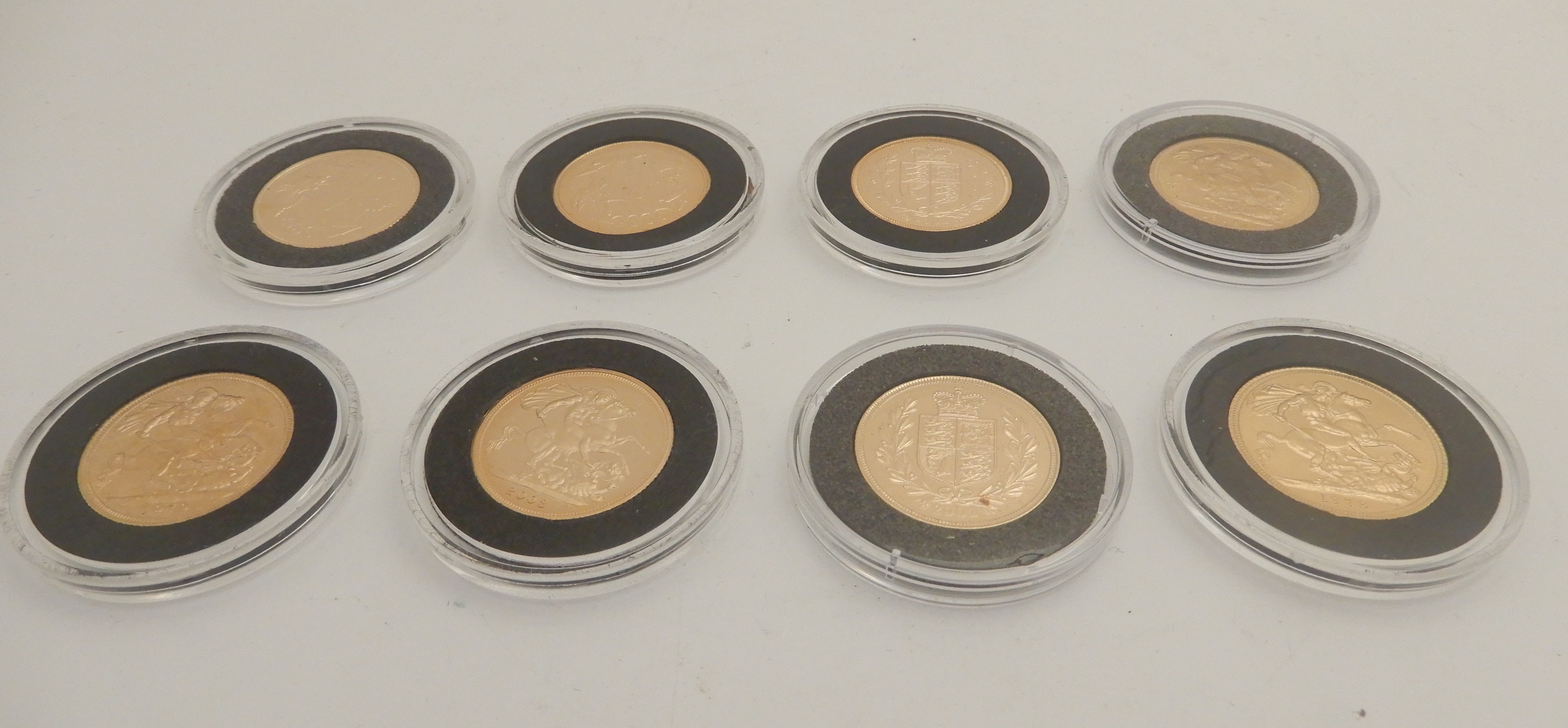 EIGHT QUEEN ELIZABETH II GOLD FULL SOVEREIGNS (ENCAPSULATED) 1968, 1979 (2), 2002 (2), 2003, 2005 (
