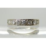 A BRIGHT YELLOW AND WHITE METAL DIAMOND HALF ETERNITY RING set with estimated approx 0.64cts in