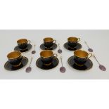 A SET OF SIX ROYAL WORCESTER DEMITASSE CUPS AND SAUCERS circa 1915, the black ground with gilt