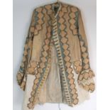 AN 18TH CENTURY FROCK COAT the duck egg blue silk ground with peach diamond shaped panels and
