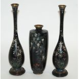 A JAPANESE CLOISONNE BLACK GROUND VASE decorated with birds on wisteria branches, makers mark to