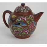 A CHINESE YIXING TEAPOT AND COVER enamelled with exotic birds amongst flowers, signed to base,
