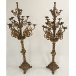 A PAIR OF VICTORIAN ORNATE CAST BRASS FLOOR STANDING CANDELABRA with sixteen branches (one missing a