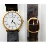 AN 18CT GOLD BAUME & MERCIER WATCH with white dial black Roman numerals and date aperture, black