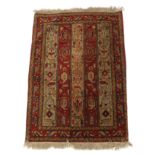 A SHIRVAN RUG with a red and cream striped design with geometric designs, 124cm x 87cm Condition