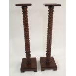 A PAIR OF MAHOGANY REPRODUCTION BARLEY TWIST PEDESTALS with square base and top, 133cm high (2)