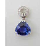 AN 18CT GOLD SAPPHIRE AND DIAMOND PENDANT the sapphire is trilliant cut and the approximate