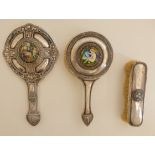AN ARTS AND CRAFTS WHITE METAL HAND MIRROR the domed back with hammered ground and applied
