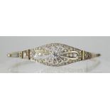 AN 18CT YELLOW AND WHITE GOLD ART DECO BRACELET the front with diamond set pierced flower motif, set