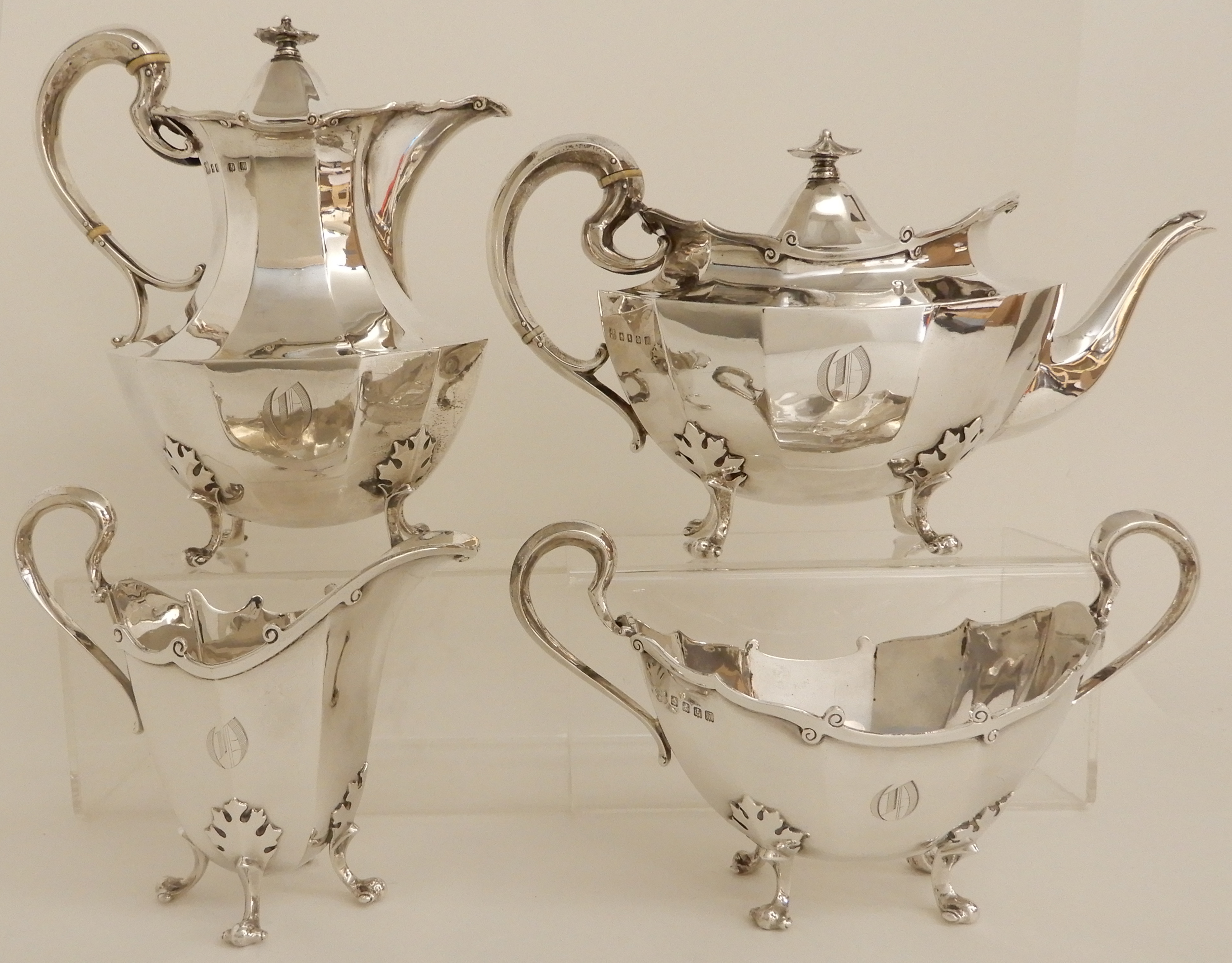 A FOUR PIECE SILVER TEA SERVICE by James Ballantyne & Son, Glasgow 1916, of faceted oval form with