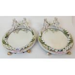 A PAIR OF MEISSEN STYLE TABLE MIRRORS early 20th Century, encrusted with lily of the valley above
