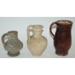 A QUANTITY OF EXCAVATED PRE COLOMBIAN POTTERY SHARDS and three early pottery jugs, 13.5cm, 18cm