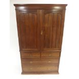 A VICTORIAN MAHOGANY LINEN PRESS stamped Maple & Co and Hobbs of London, with panelled cupboard