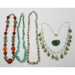 FOUR GEM SET VINTAGE NECKLACES AND A CHINESE JADE BROOCH a turquoise pebble bead necklace strung