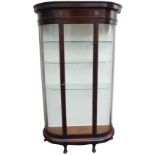 AN EARLY 20TH CENTURY MAHOGANY DISPLAY CABINET with single glazed door with curved glass sides