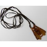 A CARVED HORN ART NOUVEAU HORNET PENDANT SIGNED PH LUCAS with knotted cord necklace, pendant 5cm x