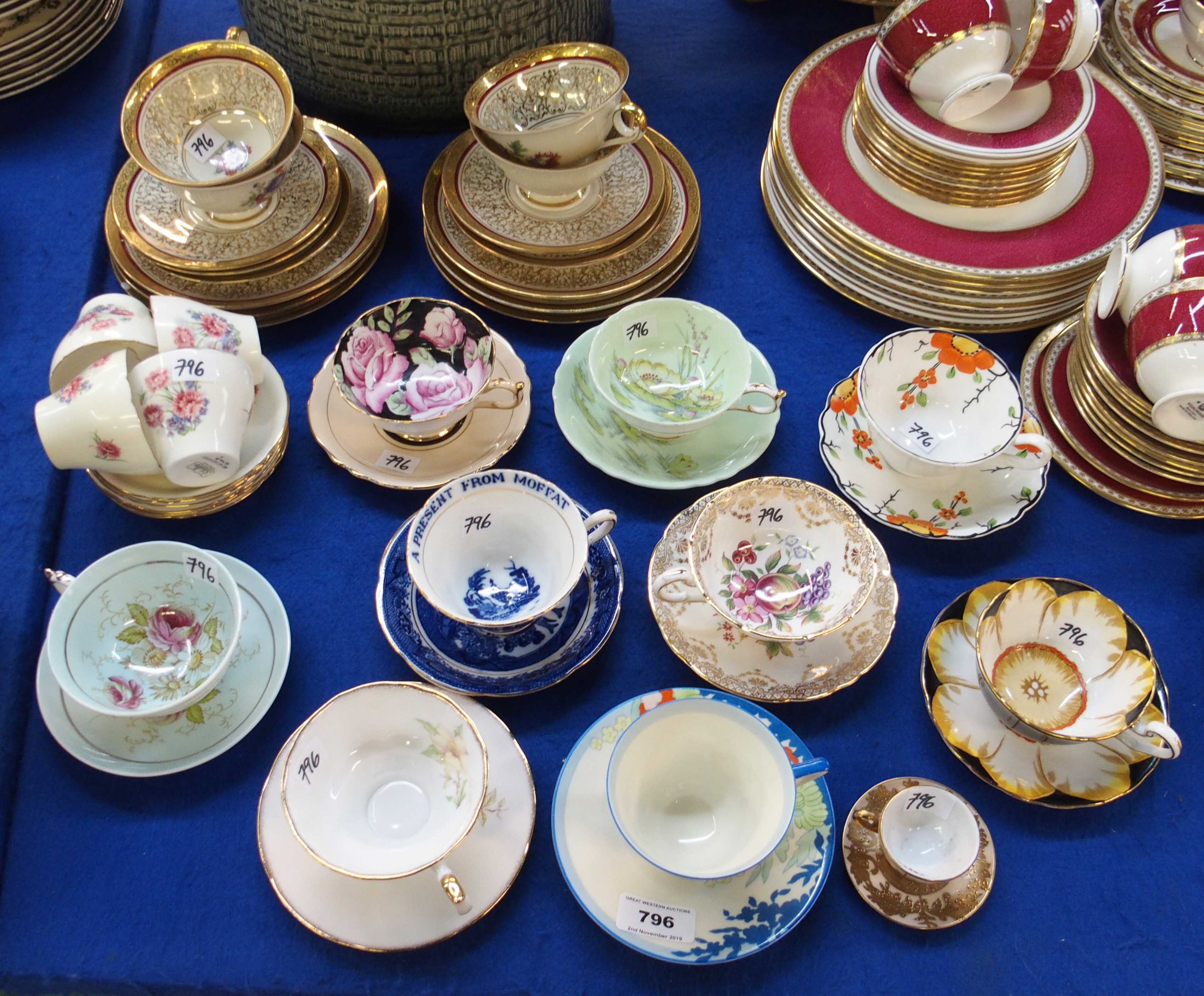 A collection of cups and saucers including Paragon, Royal Doulton, Shelley coffee cups and saucers