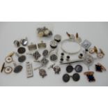 A silver bangle, a collection of silver and costume jewellery cufflinks etc Condition Report: Not