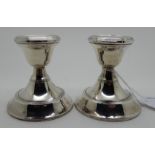 A pair of silver candlesticks, London 1921, 7.2cm high (2) Condition Report: Available upon request