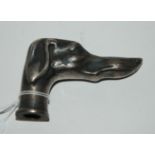 A white-metal cane handle/car mascot modelled as a dog's head Condition Report: Available upon