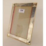A sterling silver mounted photo frame, 21.2cm x 16cm, aperture 17.3cm x 12cm Condition Report: