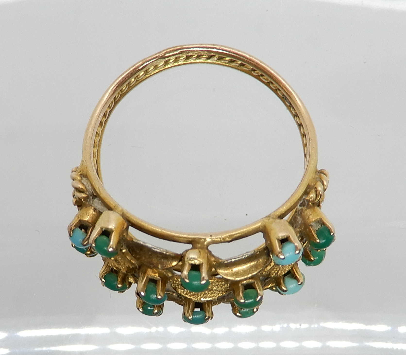 An Arabic gold turquoise set ring, size L1/2, weight 4gms Condition Report: Available upon request - Image 2 of 3