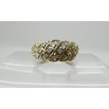 A 9ct gold diamond set ring of Celtic knotwork design, set with estimated approx 0.26cts, size M,