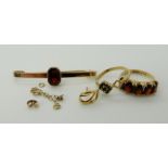 A 9ct gold garnet ring, size J1/2, 9ct garnet brooch, a 9ct gold sapphire ring size K1/2 and other