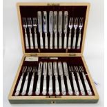 A cased twenty four piece EP and mother of pearl dessert cutlery set Condition Report: Available