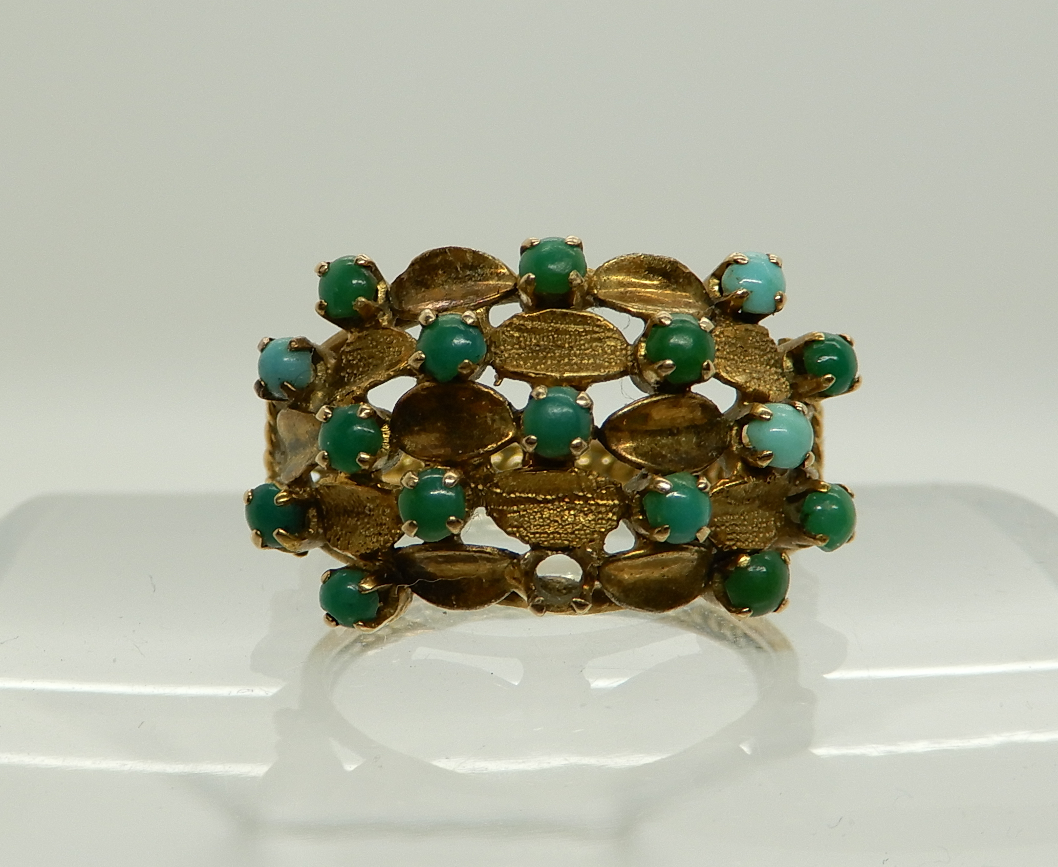 An Arabic gold turquoise set ring, size L1/2, weight 4gms Condition Report: Available upon request